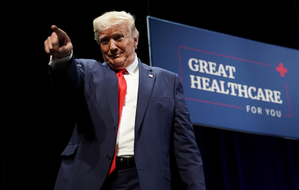 U.S. President Donald Trump points at people in the crowd after speaking during an event at The Villages retirement community in The Villages, Florida, U.S., October 3, 2019. REUTERS/Kevin Lamarque