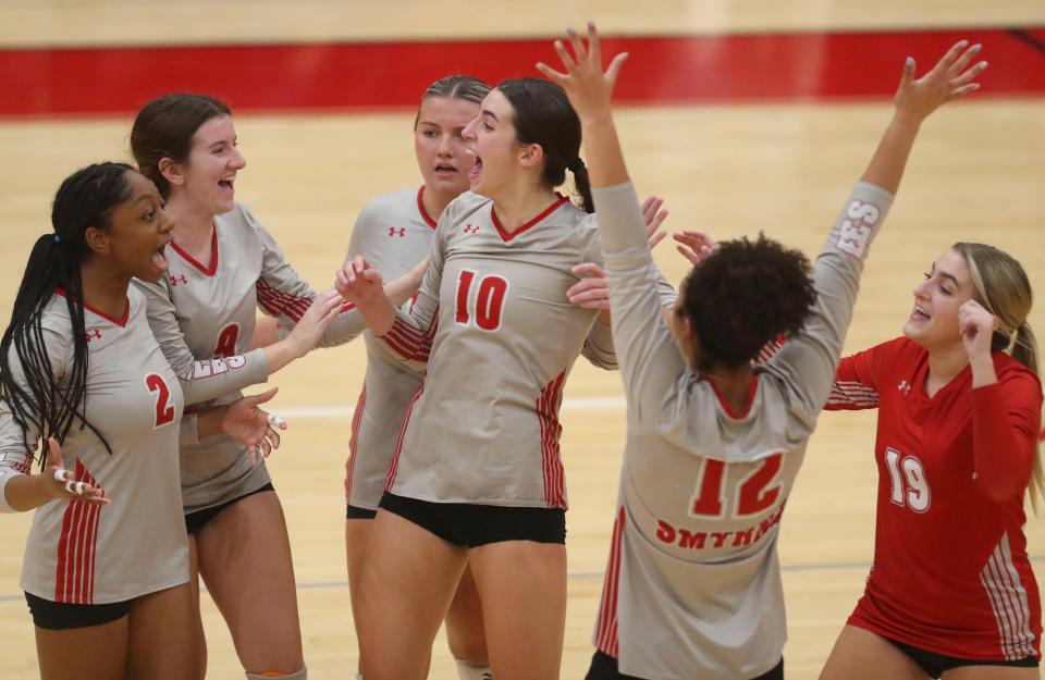 Smyrna's (from left) Elise Carter, Abigayle Osborne, Brooke Berge, Anna Richardson, Eliza Schneider and Carly Timblin react in the third set of the Spartans' 3-2 win at Smyrna, Tuesday, Oct. 10, 2023.
