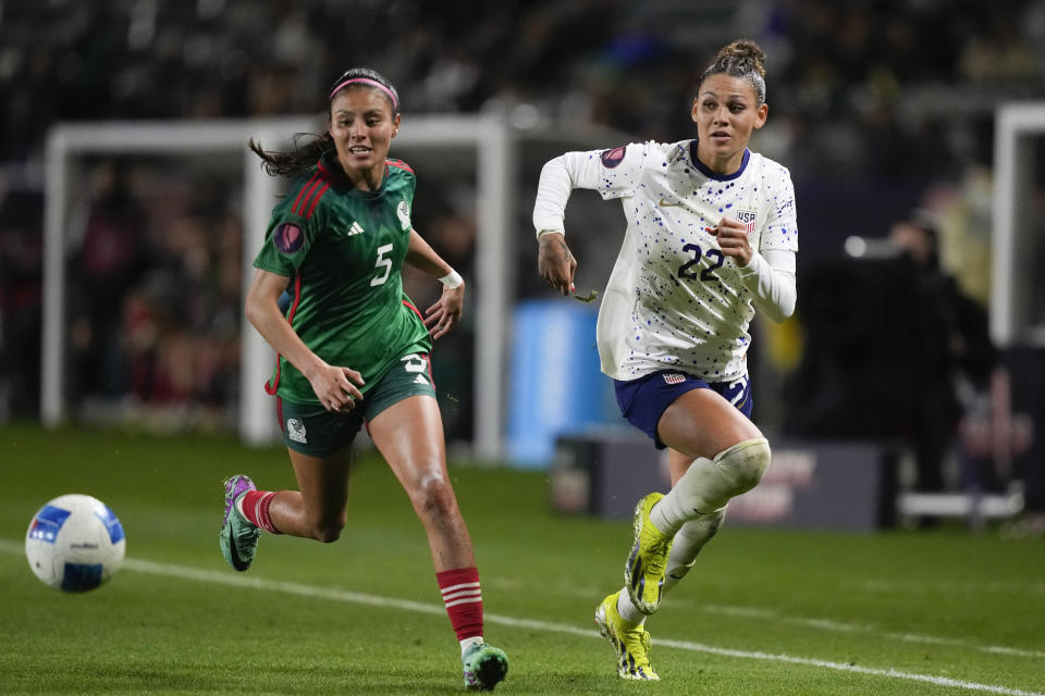 United States forward Trinity Rodman (22) and Mexico defender Karen Luna (5) chase the ball during a CONCACAF Gold Cup women's soccer tournament match, Monday, Feb. 26, 2024, in Carson, Calif. (AP Photo/Ryan Sun)