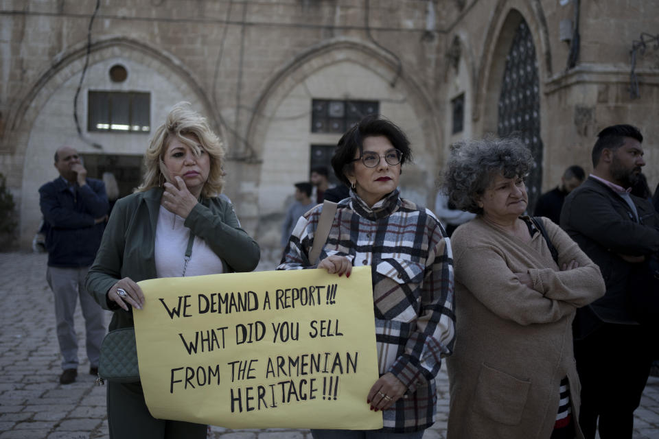 Members of the Armenian community protest a contentious deal that stands to displace residents and hand over a large section of the Armenian Quarter in the Old City of Jerusalem, Friday, May 19, 2023. Fallout from the 99-year lease of 25% of Jerusalem's Armenian Quarter has forced the highest authority of the Armenian church to cloister himself in a convent and prompted a disgraced priest to flee to southern California. (AP Photo/Maya Alleruzzo)