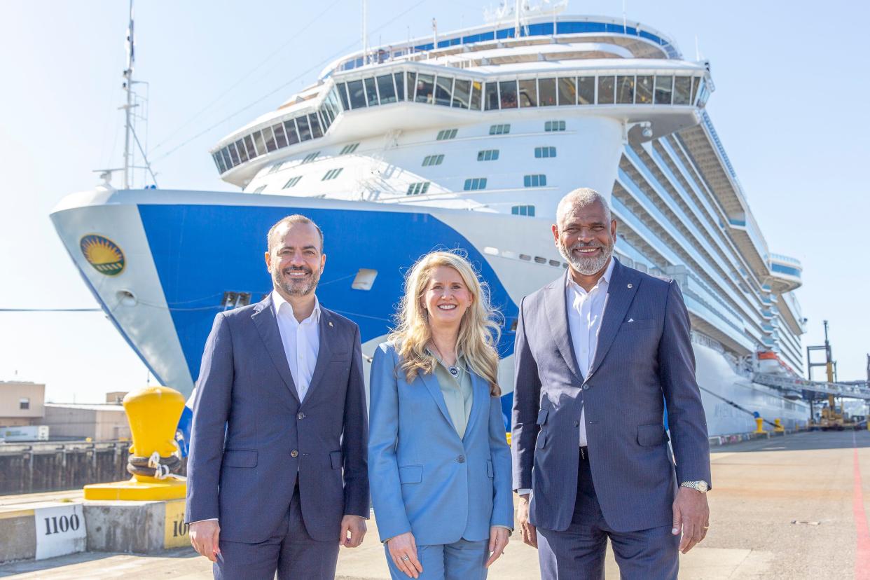Gus Antorcha, President of Holland America Line (left), Jan Swartz, Princess Cruises President (middle) and Arnold Donald, President and CEO Carnival Corp. (right) in front of Majestic Princess in the Port of Seattle.