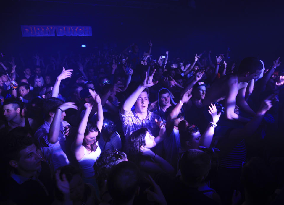 Clubbers dance at the Ministry of Sound nightclub in south London April 29, 2012. REUTERS/Olivia Harris (BRITAIN - Tags: ENTERTAINMENT SOCIETY)