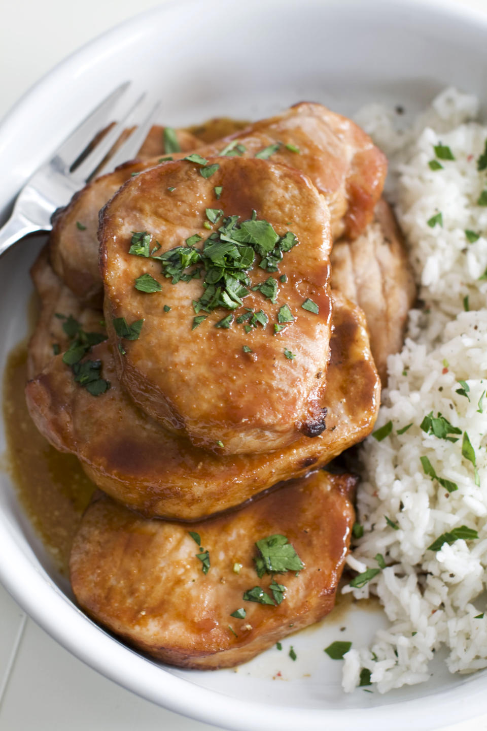 In this image taken on Jan. 21, 2013, sticky marinated pork chops are shown in Concord, N.H. (AP Photo/Matthew Mead)