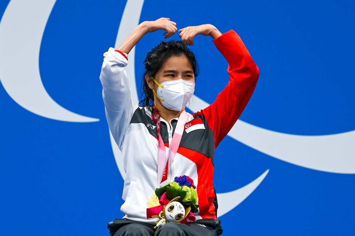 Gold medallist Singapore's Yip Pin Xiu celebrates on the podium after the women's 50m backstroke (S2) final at the 2020 Tokyo Paralympics. (PHOTO: Sport Singapore)