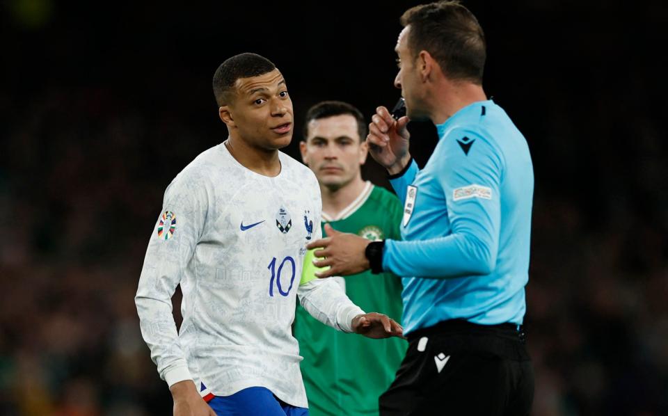 France's Kylian Mbappe remonstrates with referee Artur Dias - REUTERS/Clodagh Kilcoyne