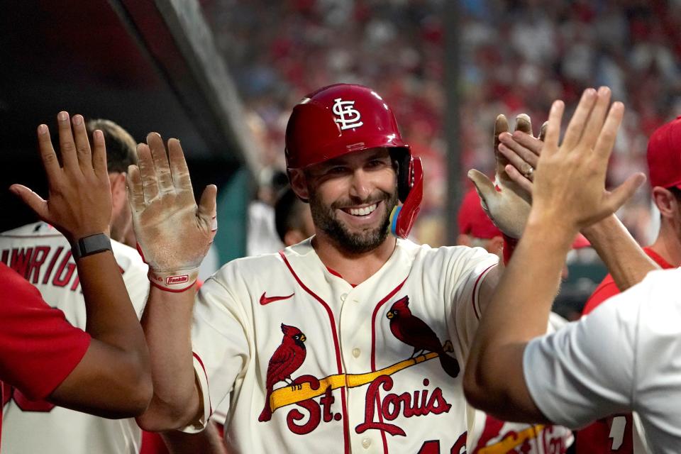 FILE - St. Louis Cardinals' Paul Goldschmidt is congratulated by teammates after scoring during the seventh inning of a baseball game against the Milwaukee Brewers Saturday, Aug. 13, 2022, in St. Louis. New AL home run king Aaron Judge and St. Louis slugger Paul Goldschmidt won Hank Aaron Awards on Wednesday, Nov. 9, 2022, that reward the most outstanding offensive performers in each league. (AP Photo/Jeff Roberson, File)