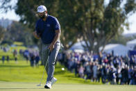 Jon Rahm, of Spain, reacts after making his putt for birdie on the 15th hole of the South Course at Torrey Pines during the third round of the Farmers Insurance Open golf tournament, Friday, Jan. 27, 2023, in San Diego. (AP Photo/Gregory Bull)