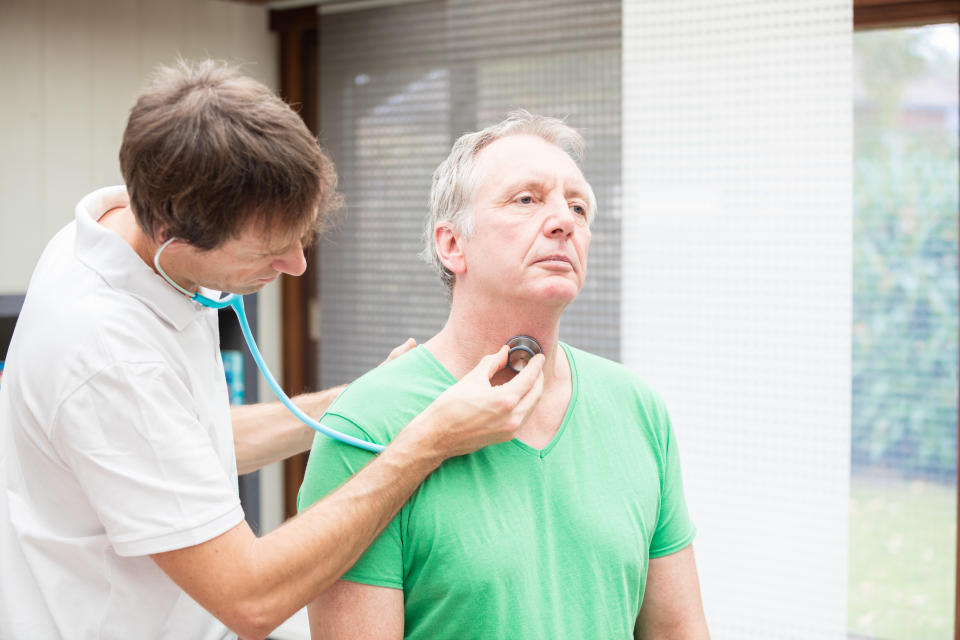 A doctor, performing an auscultation of a patient`s thyroidea. Image taken with Canon EOS 5 Ds and EF 70-200mm 2,8 USM L.