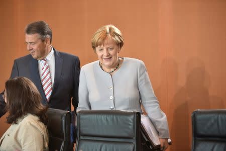 German Chancellor Angela Merkel and Foreign Minister Sigmar Gabriel attend the weekly cabinet meeting at the Chancellery in Berlin, Germany June 21, 2017. REUTERS/Stefanie Loos