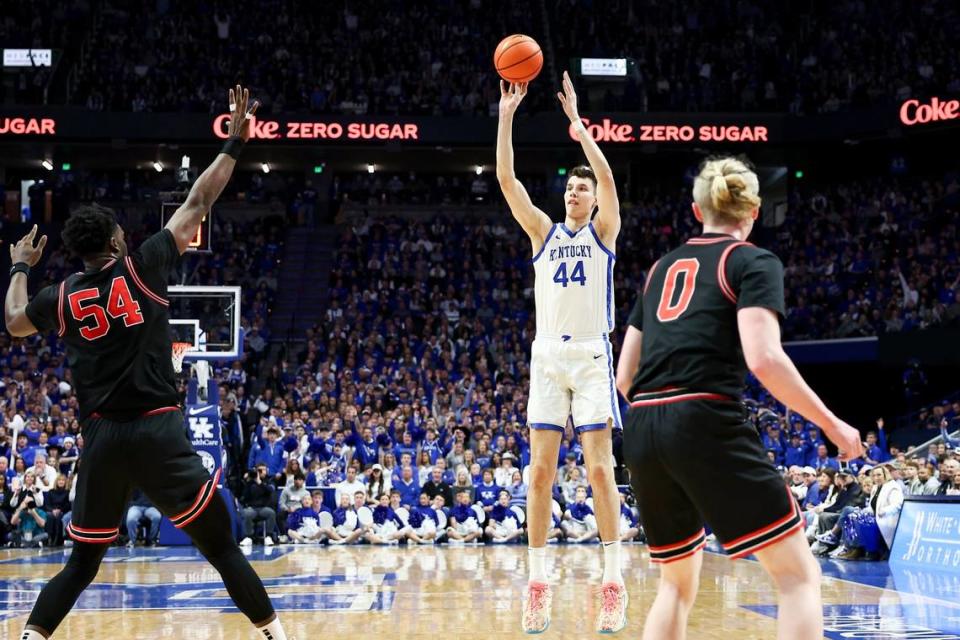 Kentucky Wildcats forward Zvonimir Ivisic (44) shoots the ball for three points against Georgia Bulldogs center Russel Tchewa (54) during the game at Rupp Arena in Lexington, Ky, Saturday, January 20, 2024.