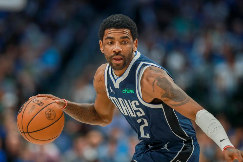 Dallas Mavericks guard Kyrie Irving looks to drive to the basket during the first half of an NBA basketball game against the Phoenix Suns, Sunday, March 5, 2023, in Dallas.