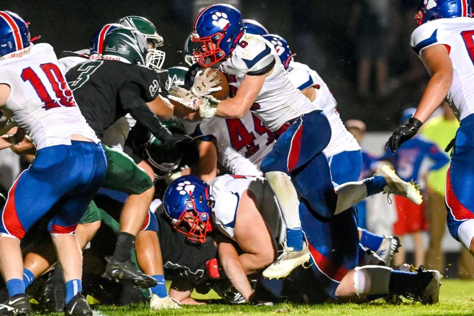 Mason's Derek Badgley scores a touchdown against Williamston during the third quarter on Friday, Sept. 16, 2022, in Williamston.