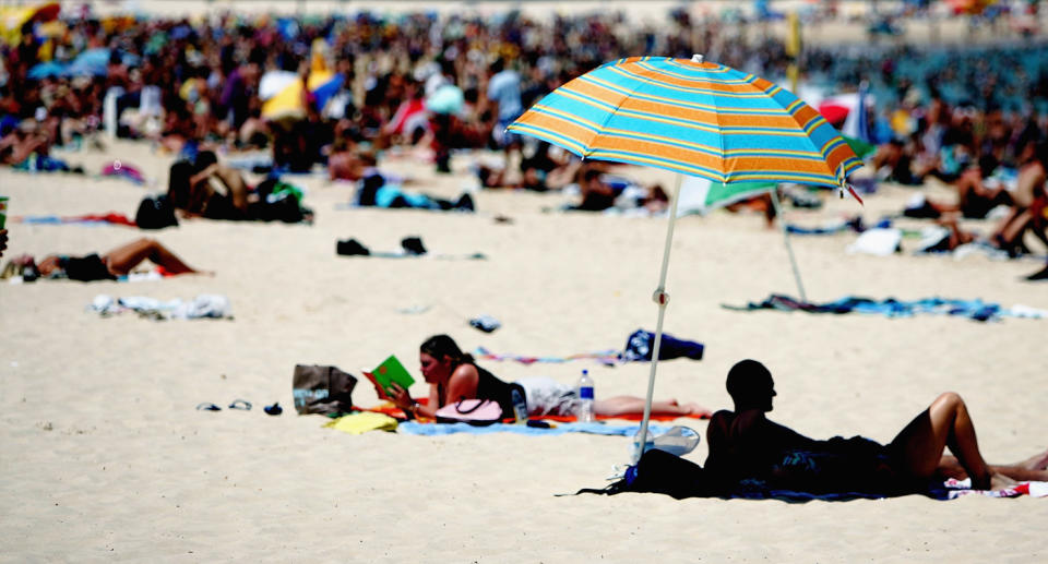 People at beach on hot day. 