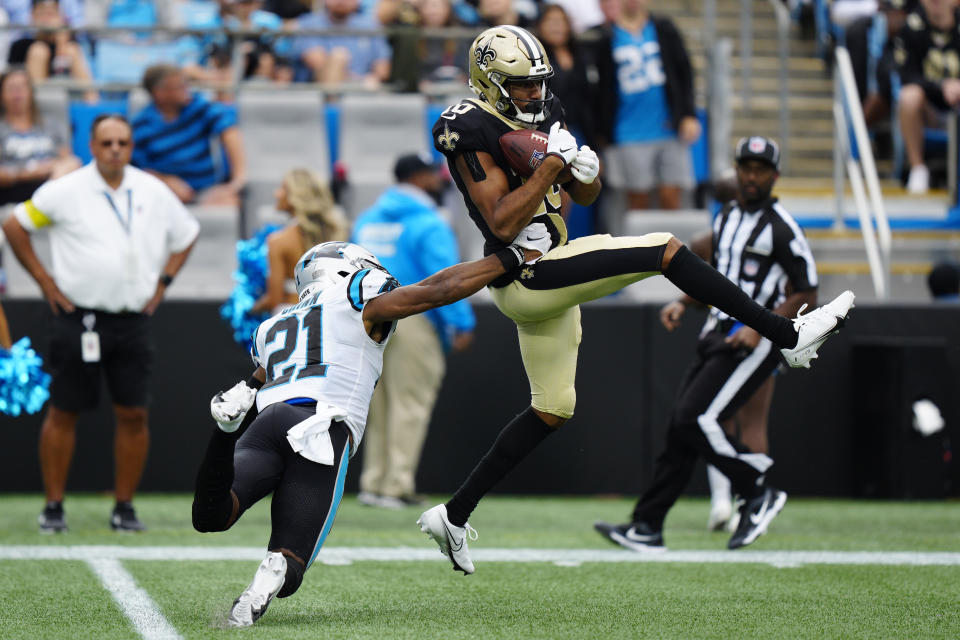 New Orleans Saints wide receiver Tre'Quan Smith (10) catches a pass against Carolina Panthers safety Jeremy Chinn (21) during the second half of an NFL football game, Sunday, Sept. 25, 2022, in Charlotte, N.C. (AP Photo/Jacob Kupferman)