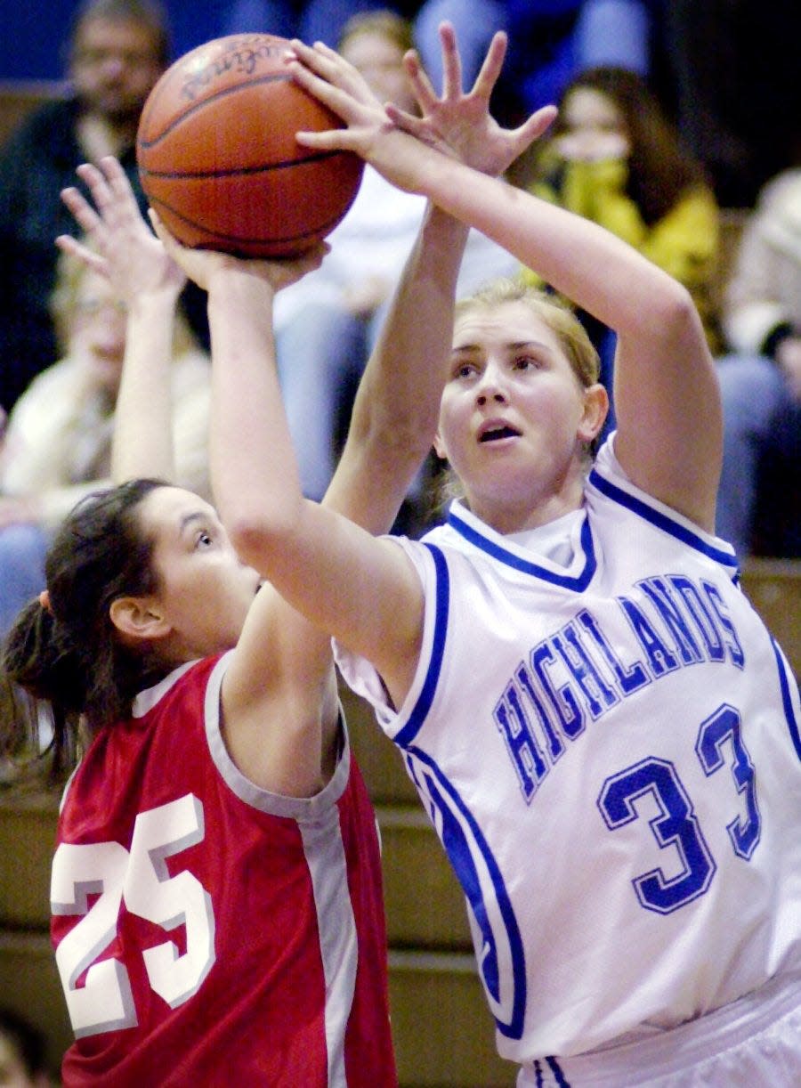 Highlands' Tara Boothe goes up for a shot over Dixie Heights' Sarah Wright in the first half of their Ninth Region girls basketball tournament in Hebron, March 7, 2001.