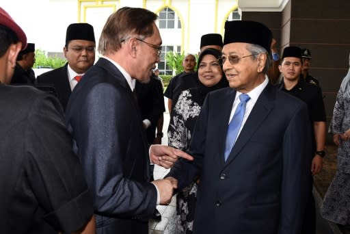 Anwar says his relationship with Mahathir Mohamad (R) is now 'very cordial'