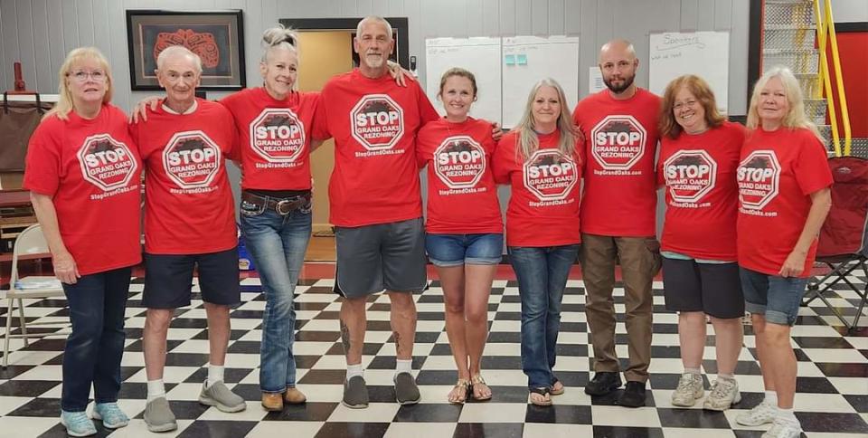 Members of Stop Grand Oaks, from left, Romayne Jones, Lazlo Lipovics, Kathleen Farner, Tom Nash, Jorlyn Johnson, Mary Shaner, Andrei Nana, Dr. Lisa Berg and Laurie Smith.