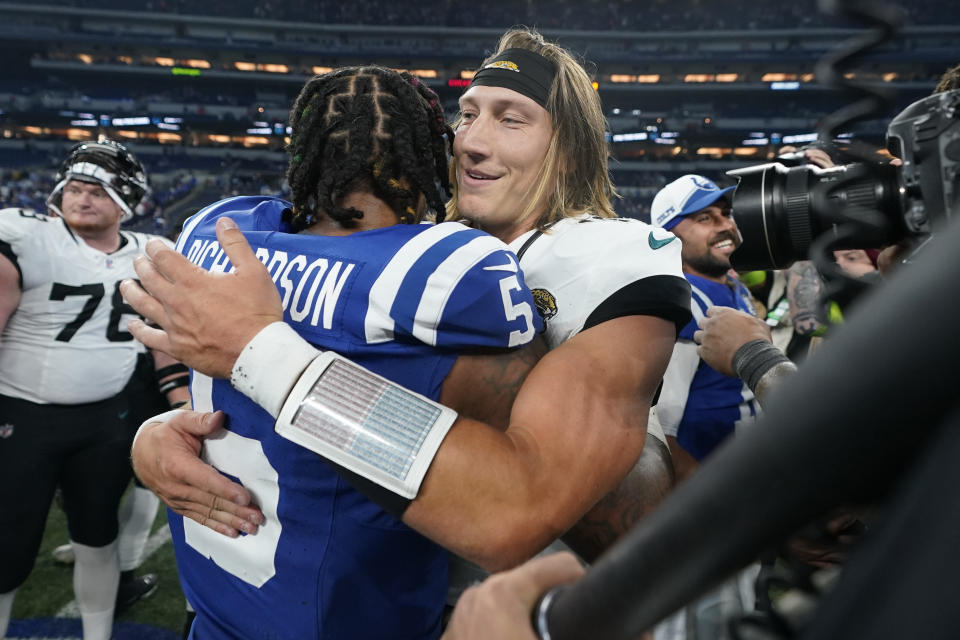 Indianapolis Colts quarterback Anthony Richardson (5) and Jacksonville Jaguars quarterback Trevor Lawrence hug following an NFL football game Sunday, Sept. 10, 2023, in Indianapolis. The Jaguars won 31-21. (AP Photo/Darron Cummings)