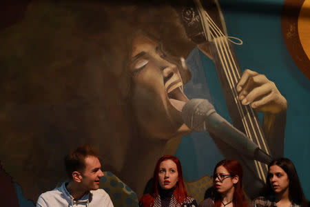 Choir members practice during a text rehearsal of "The Slobodan Show" play in Belgrade, Serbia, January 20, 2018. Picture taken January 20, 2018. REUTERS/Djordje Kojadinovic