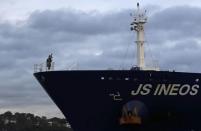 A piper plays as the tanker carrying the first shipment of U.S. shale gas passes under the Forth Bridge as it travels to dock at Grangemouth in Scotland, Britain September 27, 2016. REUTERS/Russell Cheyne