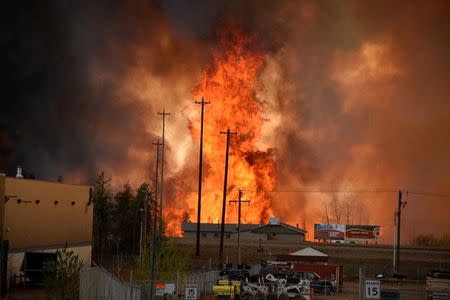 Flames rise in Industrial area south Fort McMurray, Alberta Canada May 3, 2016. Terry Reith/CBC News/Handout via REUTERS