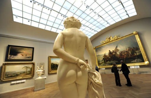 Members of the press take a tour of a room in the Metropolitan Museum of Art's New American Wing Galleries for Paintings, Sculpture and Decorative Arts in New York