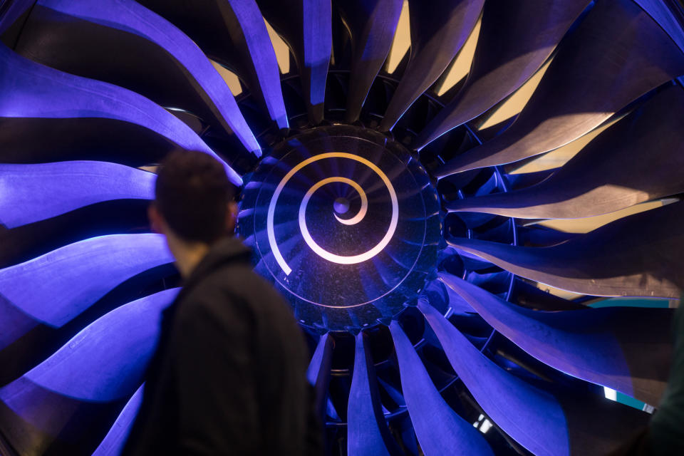 (Bloomberg) -- Rolls-Royce Holdings Plc’s Warren East said he’s keen to lead the engine maker into a new age of electrically powered aircraft after spending years focused on costs cuts and restructuring.The CEO, recruited by Rolls from semiconductor developer ARM Holdings Plc, said his enthusiasm for leading the U.K. engineering giant is undimmed by the saga of firings, disposals and internal realignments, and that he wants to stay at the helm through a new phase of expansion and technological change.“I didn’t join Rolls-Royce to do restructuring,” East, who has been chief executive for four years next month, said in an interview at the Paris Air Show. “I’m not a turnaround person. Once you’ve made it a more competitive business you want to resume the journey of growing market share.”East took over after Rolls had been rocked by a run of profit warnings and a corruption probe. Things got worse before they got better, with the CEO saying problems were more deep-seated than he’d realized and ordering thousands of job cuts. Technical faults with the Trent 1000 engine that powers Boeing Co.’s 787 also forced the group to focus on emergency repairs when it should have been preoccupied with a production ramp-up vital to future earnings.Rolls-Royce’s margins are still behind those of other major aero-engine manufacturers and East said he needs to close that gap and make the London-based company more competitive before he can return to expansion.Electric FutureThe upheaval that would come with a switch to hybrid and electrical propulsion could play to Rolls’s advantage, the CEO said, with the “discontinuity” creating an opportunity to grab a higher market share in a wholly new market.A move away from jet propulsion had been regarded as decades away, but Airbus SE is now actively studying the introduction of an electric-hybrid design with its next narrow-body plane, and such technology has been a hot topic at this week’s aviation expo in the French capital.“A few years ago there wasn’t this noise at an air show about electric propulsion, you really had to look hard for it, if at all,” East said.Rolls put down a marker at the show with the purchase of a Siemens AG business that formed part of a venture with Airbus to build a small regional hybrid aircraft, and the CEO said the greater potential of electric planes is clear, with performance improvements of no more than 1% a year being eked out from gas turbines, compared with a 10% jump in battery energy density.East said cutting so many jobs has been tough, but that his aim is to position Rolls to be competitive for the next 50 years and beyond.“It’s obviously uncomfortable for some people who are either going to lose their job themselves, or they know somebody who is going to lose their job,” he said. “But it’s getting them to understand that we’re not some hard-man management that is just doing this so we can line the pockets of investors.”To contact the reporter on this story: Benjamin Katz in Paris at bkatz38@bloomberg.netTo contact the editors responsible for this story: Anthony Palazzo at apalazzo@bloomberg.net, Christopher Jasper, Andrew NoëlFor more articles like this, please visit us at bloomberg.com©2019 Bloomberg L.P.