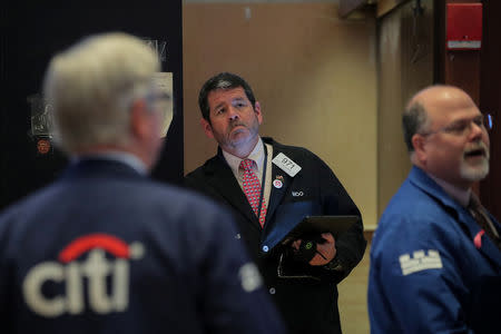 Traders work on the floor at the New York Stock Exchange (NYSE) in New York, U.S., April 30, 2019. REUTERS/Brendan McDermid