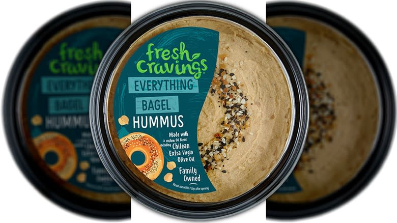 Pot of hummus with seeds