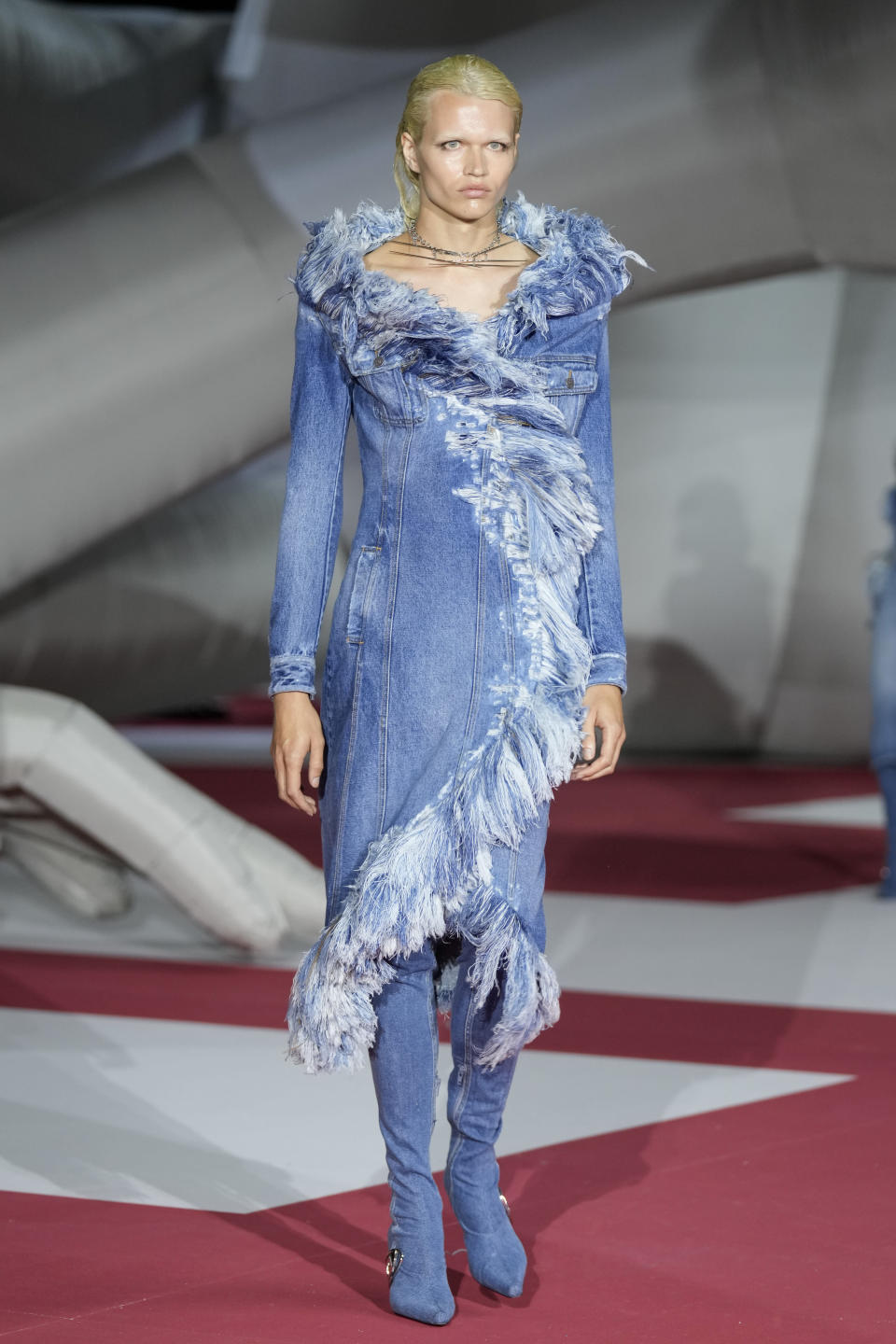 A model wears a creation as part of the Diesel women's Spring Summer 2023 collection presented in Milan, Italy, Wednesday, Sept. 21, 2022. (AP Photo/Antonio Calanni)
