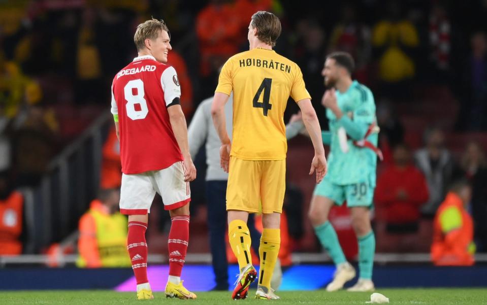 Martin Oedegaard of Arsenal speaks to Marius Hoibraten of FK Bodo/Glimt - Shaun Botterill/Getty Images