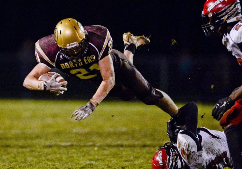 North East running back Garrett Owens is tripped by Fairview's Jose Lopez during an Oct. 30, 2015, football game between the Grapepickers and Tigers at North East's Ted Miller Stadium. Owens rushed for 5,128 yards and 68 touchdowns during his varsity career.