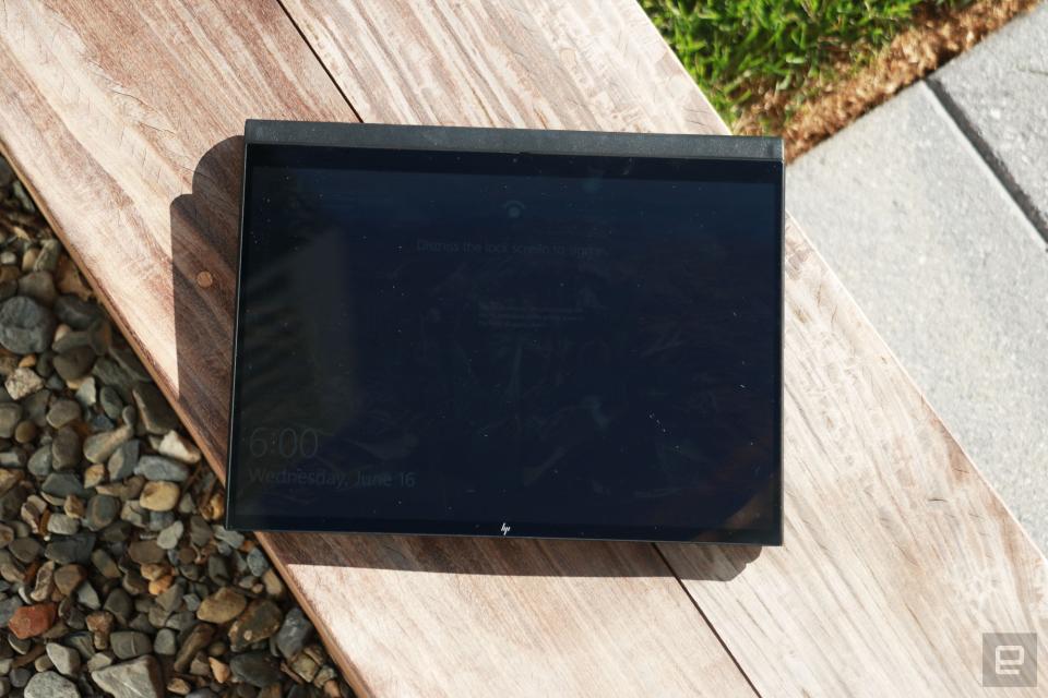 <p>HP Elite Folio Engadget review photo: A top down shot of the laptop with its screen facing out laying flat on the keyboard, set up as a tablet. Contents on the screen are barely visible under bright sunlight.</p>
