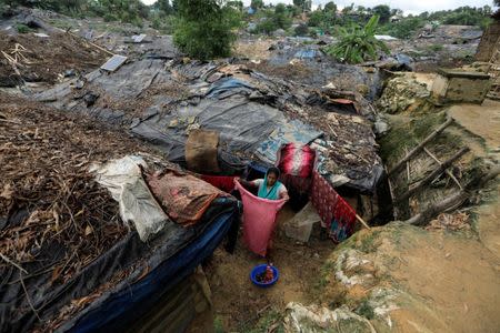 A Rohingya refugee woman hangs her washing out in Balukhali refugee camp near Cox's Bazar, Bangladesh October 22, 2017. REUTERS/Zohra Bensemra