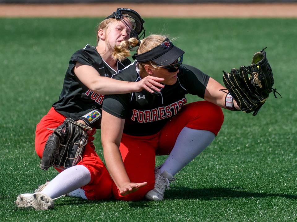 Forreston's Alaina Miller, left, and Aubrey Sanders collide on a shallow Newark pop-up in the outfield during the Class 1A state softball third-place game Saturday, June 4, 2022 at the Louisville Slugger complex in Peoria. Sanders held on to the ball for the final out, giving the Cardinals a 4-2 win in eight innings.