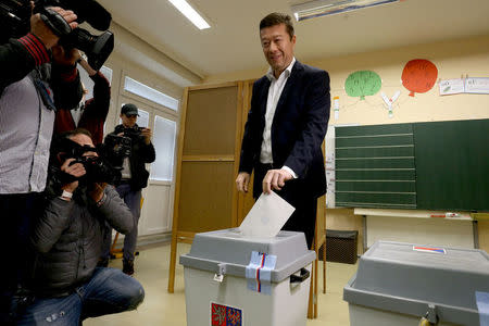 The leader of Freedom and Direct Democracy (SPD) party Tomio Okamura casts his vote in parliamentary election in Prague, Czech Republic October 20, 2017. REUTERS/Milan Kammermayer