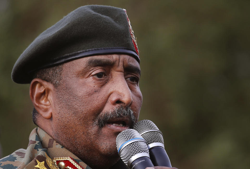 FILE - Sudanese Gen. Abdel-Fattah Burhan speaks during a military-backed rally in Omdurman district, west of Khartoum, Sudan, Saturday, June 29, 2019. Sudan’s leader said Monday, Oct. 26, 2020 that the decision to normalize ties with Israel was an incentive for President Donald Trump’s administration to end Sudan’s international pariah status. Gen. Abdel-Fattah Burhan, head of the ruling sovereign council, told state television that without the deal Sudan would have had to wait until deep into next year to be removed from the U.S.'s list of state sponsors of terrorism. (AP Photo/Hussein Malla, file)