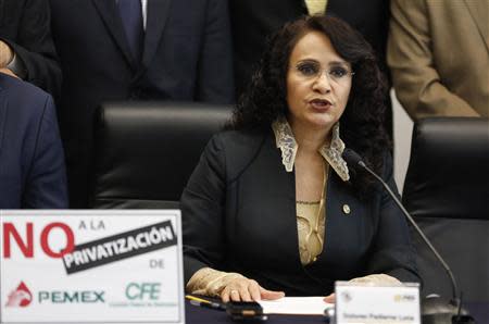 Senator Dolores Padierna of the Party of the Democratic Revolution (PRD) speaks to the media before a debate on an energy reform bill at the Senate in Mexico City December 10, 2013. REUTERS/Henry Romero