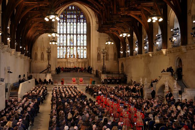 MPs, peers and other guests wait for the King and Queen Consort to arrive at Westminster Hall. (Photo: DAN KITWOOD via Getty Images)