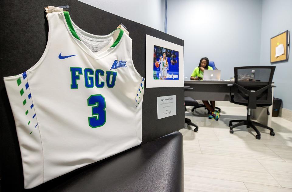 Keri Jewett-GilesÕs FGCU jersey is among keepsakes from her basketball career adorning her office at the new Boys and Girls Club on Park Meadows Drive in Fort Myers. Jewett-Giles is the clubÕs director. Jewett-Giles was a star basketball player at Dunbar High School, FGCU and played professionally. 
