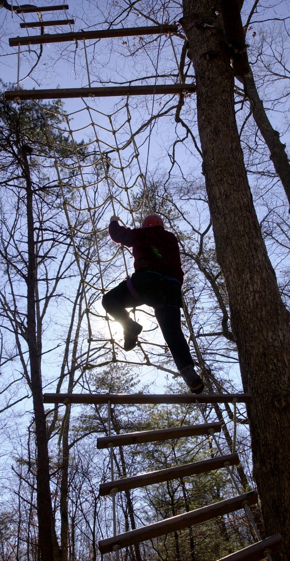 A youth climbs a ropes course in this 2001 Citizen Times photo. The camp which operated programs for adjudicated juveniles sought to build confidence with various programs.