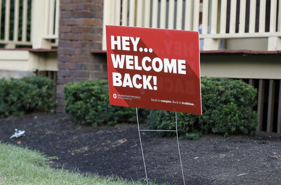 A sign hangs in the front yard of Ohio State off-campus housing on Aug. 26, 2021.