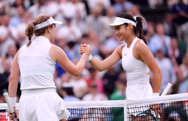 Emma Raducanu, right, shakes hands with Lulu Sun