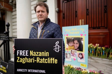 FILE PHOTO: Richard Ratcliffe, husband of British-Iranian dual national Nazanin Zaghari-Ratcliffe, poses for a photograph after delivering a Mother's Day card and flowers to the Iranian Embassy in London