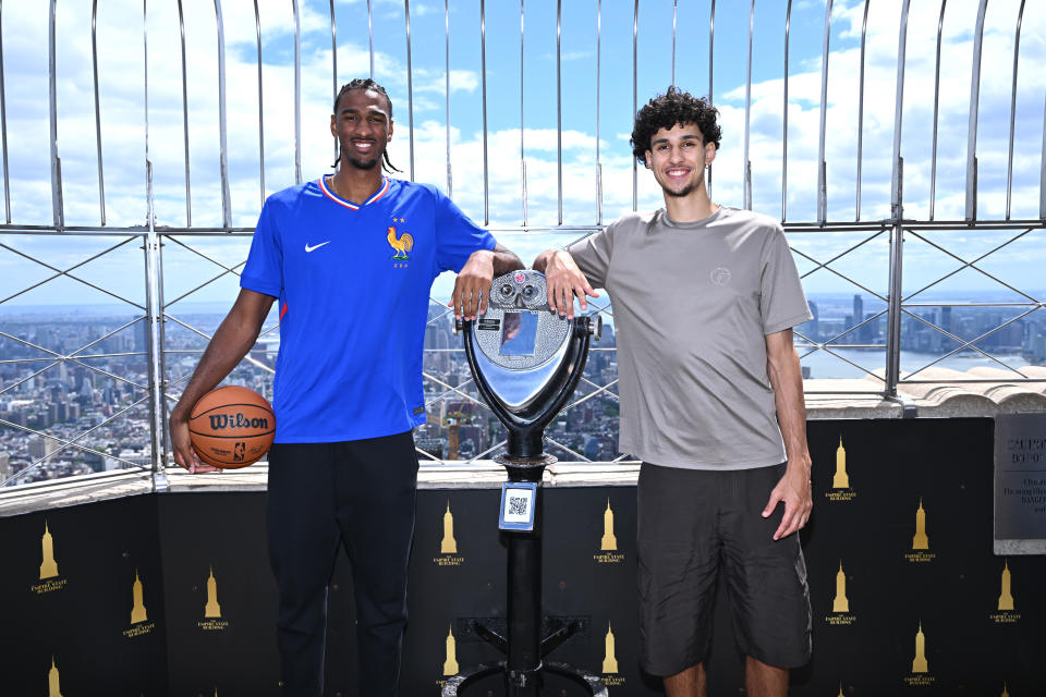 NEW YORK, NEW YORK - JUNE 24: (L-R) Alex Sarr and Zaccharie Risacher visit the Empire State Building to celebrate 2024 NBA Draft at The Empire State Building on June 24, 2024 in New York City. (Photo by Roy Rochlin/Getty Images for Empire State Realty Trust)