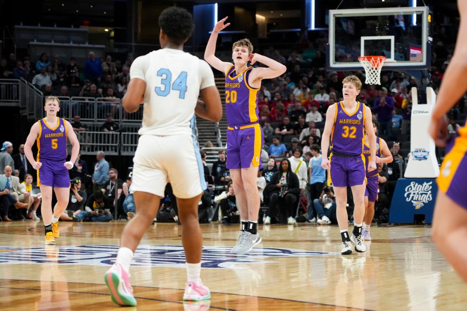 Scottsburg Warriors forward Wyatt Zellers (20) celebrates after scoring against the South Bend St. Joseph Huskies on Saturday, March 30, 2024, during the IHSAA boys basketball Class 3A state championship game at Gainbridge Fieldhouse in Indianapolis. The Scottsburg Warriors defeated the South Bend St. Joseph Huskies 67-57.