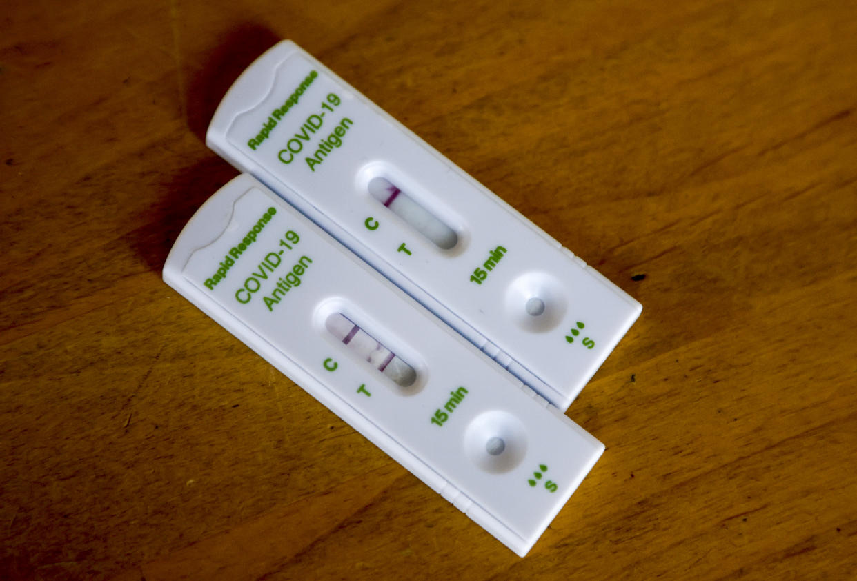 British Columbia is experiencing a spike in COVID numbers, with cases, test positivity, hospitalizations and deaths all up in recent weeks. Positive, left, and negative COVID-19 antigen rapid tests are pictured in Calgary, Alta., Tuesday, Jan. 4, 2022. THE CANADIAN PRESS/Jeff McIntosh