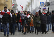 Protesters attend the procession in downtown Minsk, Belarus, Saturday, Dec. 7, 2019. More than 1,000 opposition demonstrators are rallying in Belarus to protest closer integration with Russia. Saturday's protest in the Belarusian capital comes as Belarusian President Alexander Lukashenko is holding talks with Russian President Vladimir Putin in Sochi on Russia's Black Sea coast. (AP Photo/Sergei Grits)