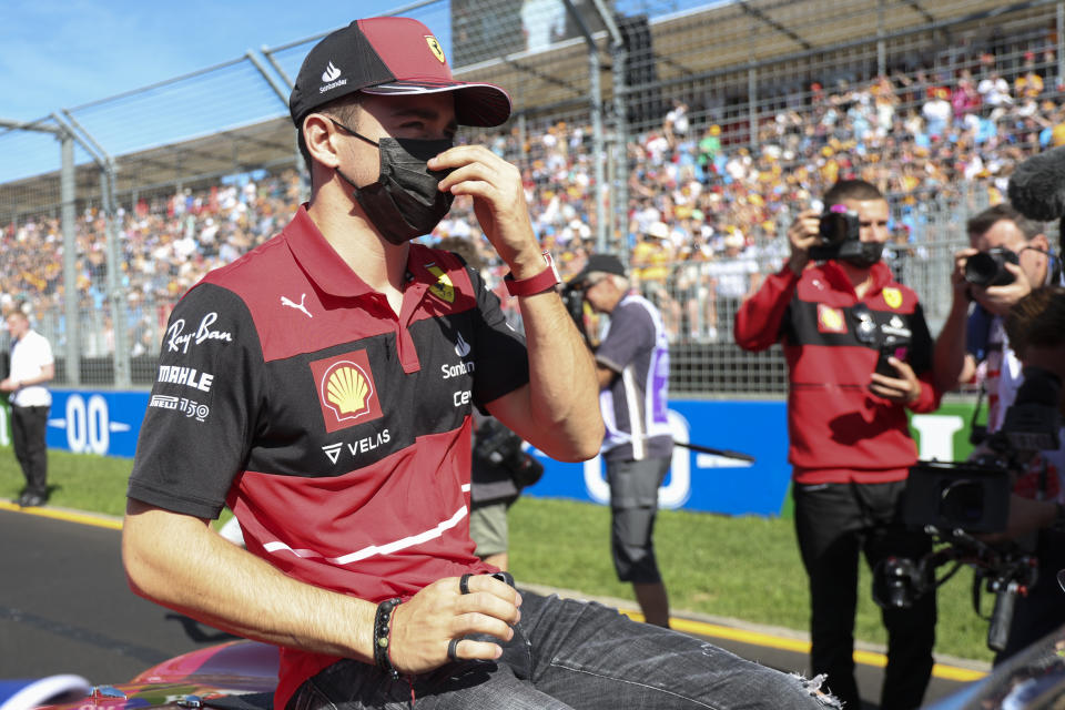 Ferrari driver Charles Leclerc of Monaco gestures during the drivers parade ahead of the Australian Formula One Grand Prix in Melbourne, Australia, Sunday, April 10, 2022. (AP Photo/Asanka Brendon Ratnayake)