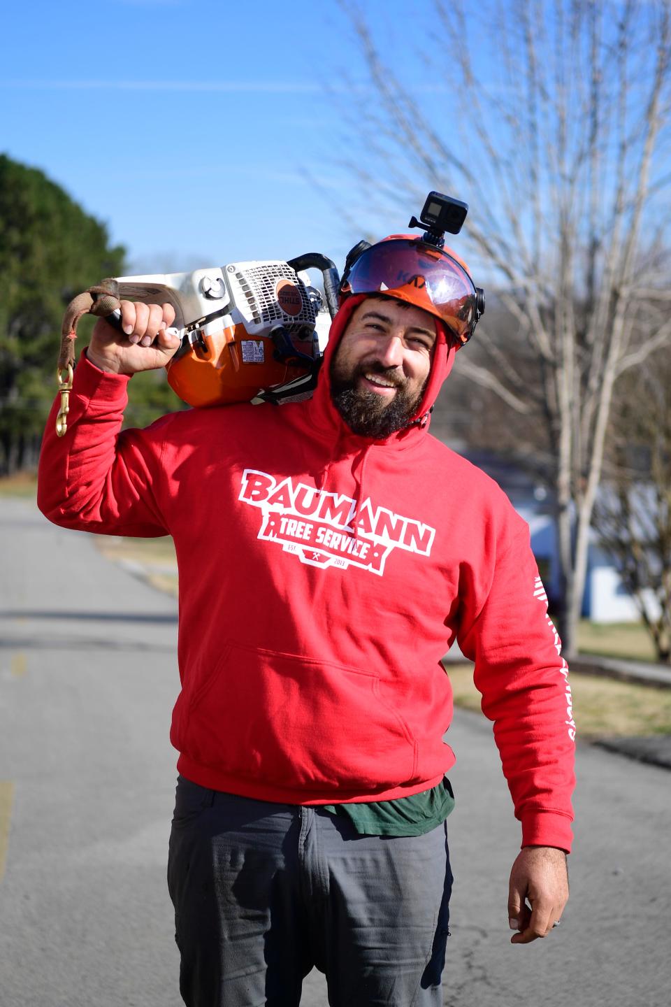 Matt Baumann, who goes by Tree Cowboy, poses for a photo on the job in Clinton, Tuesday, Dec. 15, 2020. Baumann owns Baumann Tree Service.